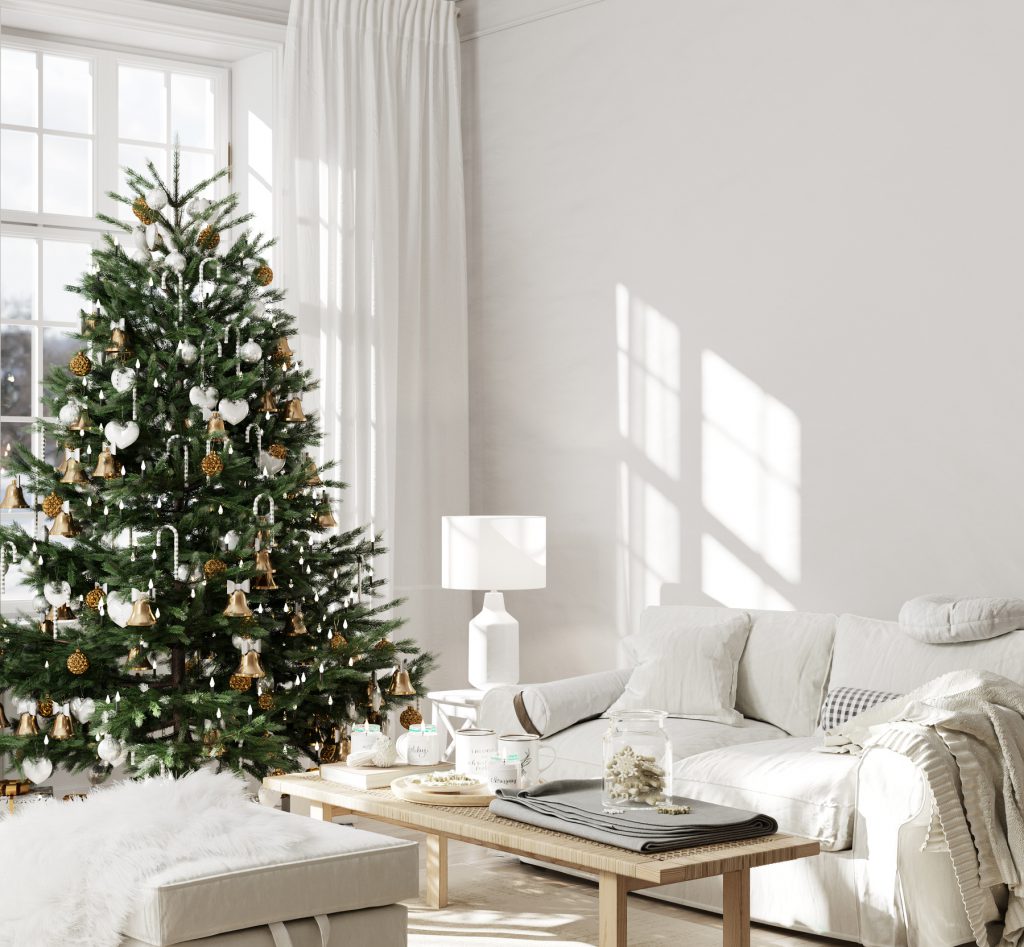 Christmas living room interior in light colors with a Christmas tree near the window